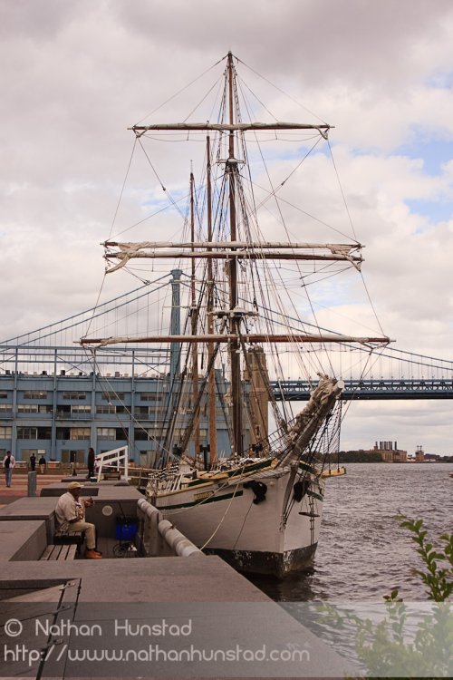 A ship with the Ben Franklin Bridge in the background